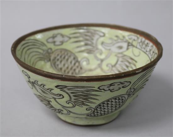 A Chinese enamelled biscuit phoenix bowl, incised decoration